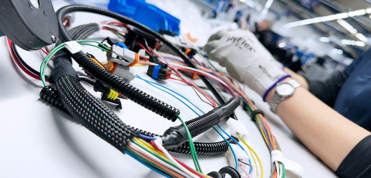A Wiring Harnesses being completed on a work bench at Cornelius Electronics