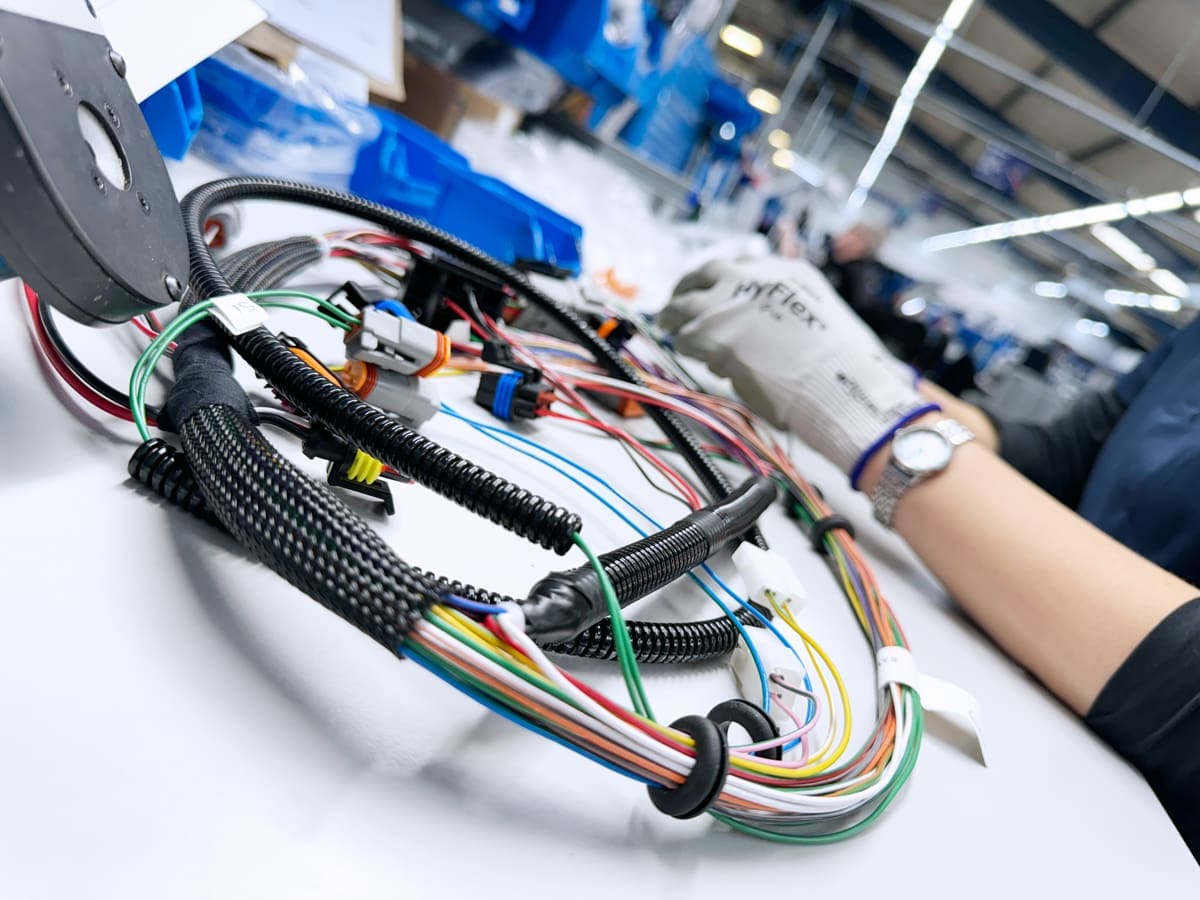 A Wiring Harnesses being completed on a work bench at Cornelius Electronics